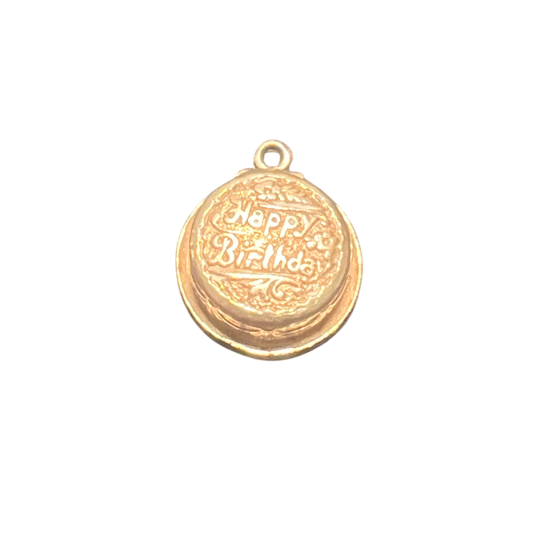 Gold pendant with 'Happy Birthday' engraving on a white background