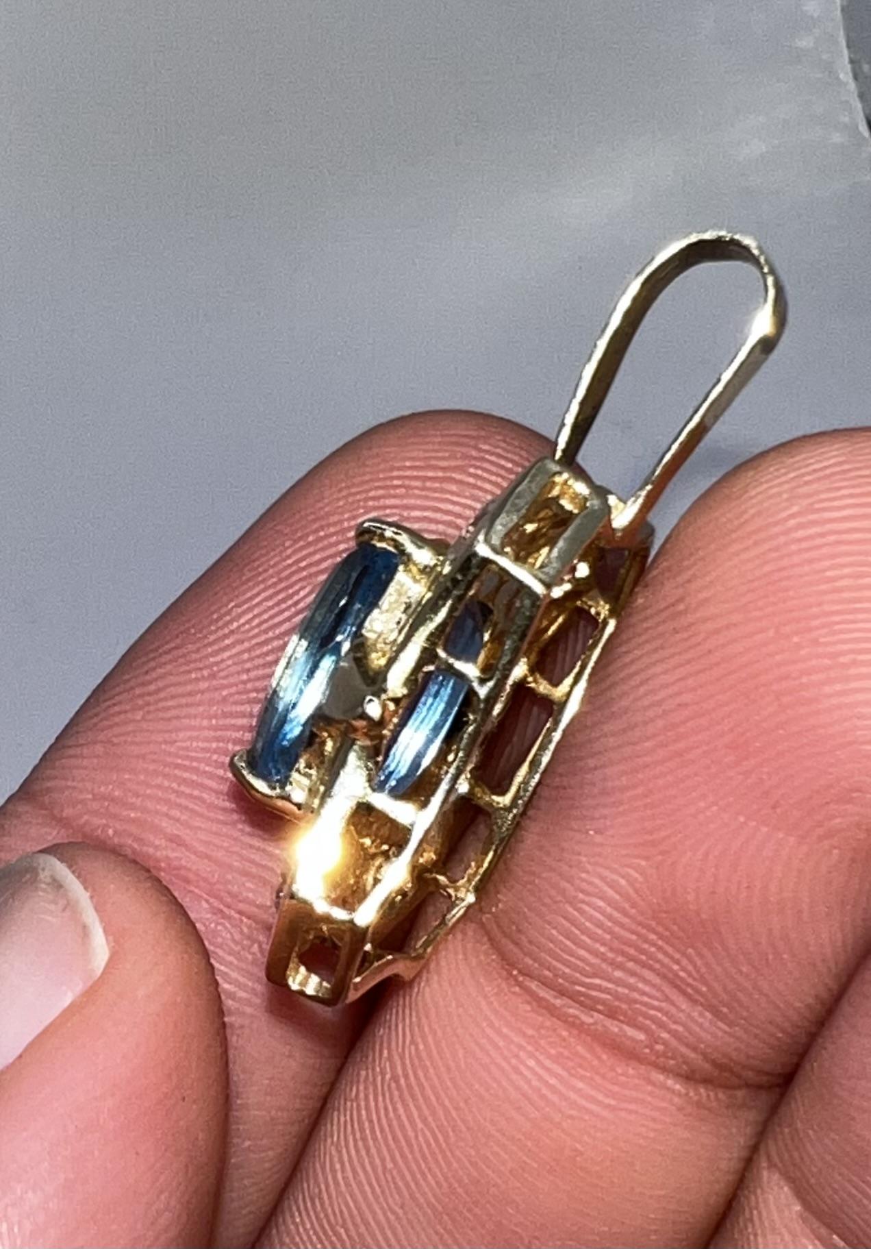 Blue Topaz and Diamond Pendant