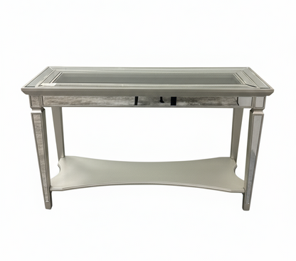 Decorative side table with mirrored top and silver frame on a white background