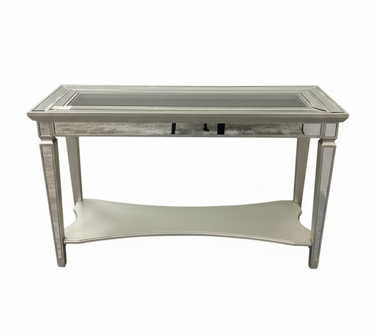 Decorative side table with mirrored top and silver frame on a white background