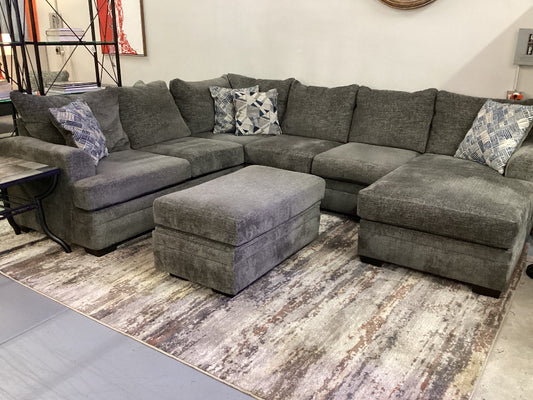 Gray sectional reversible chaise with storage ottoman|4495